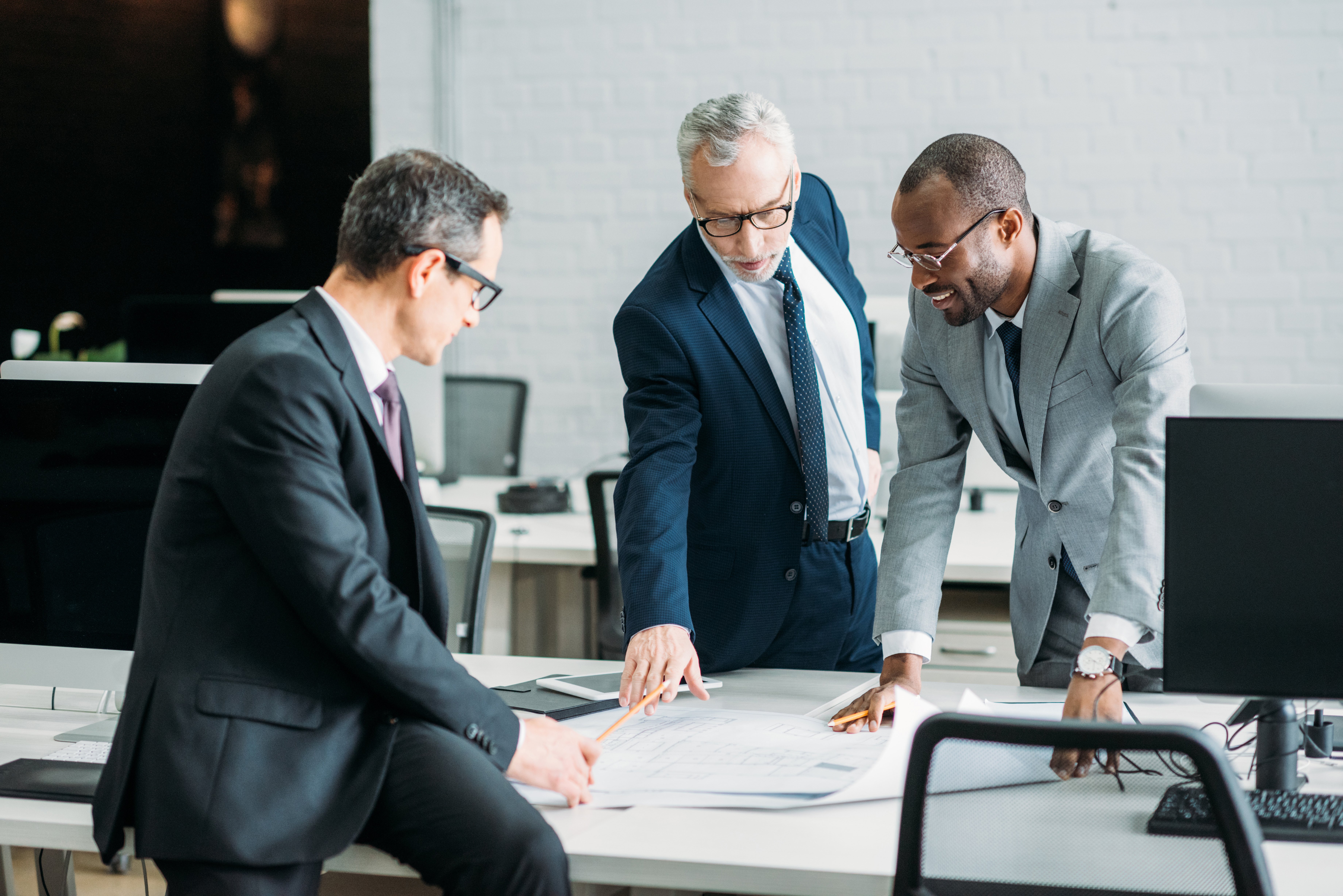 Multiethnic Businessmen Discussing New Business Strategy